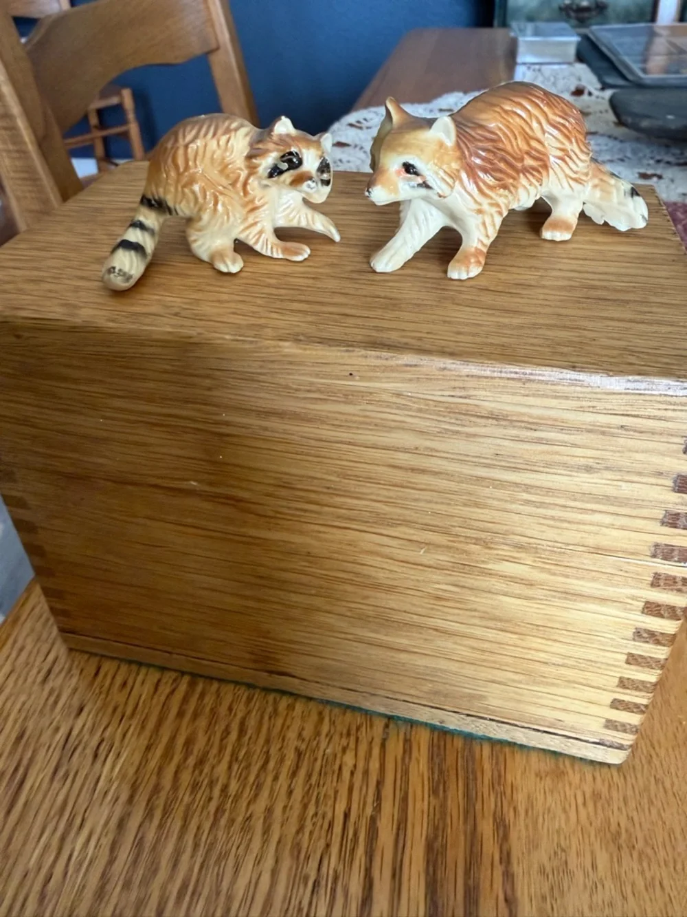 Mini pair of raccoon figurines